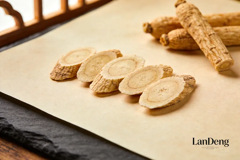 Dried angelica root slices with a few whole root pieces.